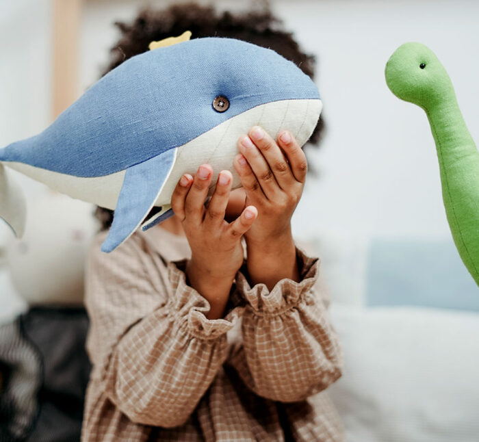 Boy Holding Whale toy